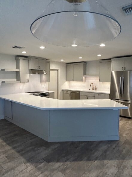 New Kitchen with new quartz countertops and new cabinetry - 8226 E Mitchell Dr