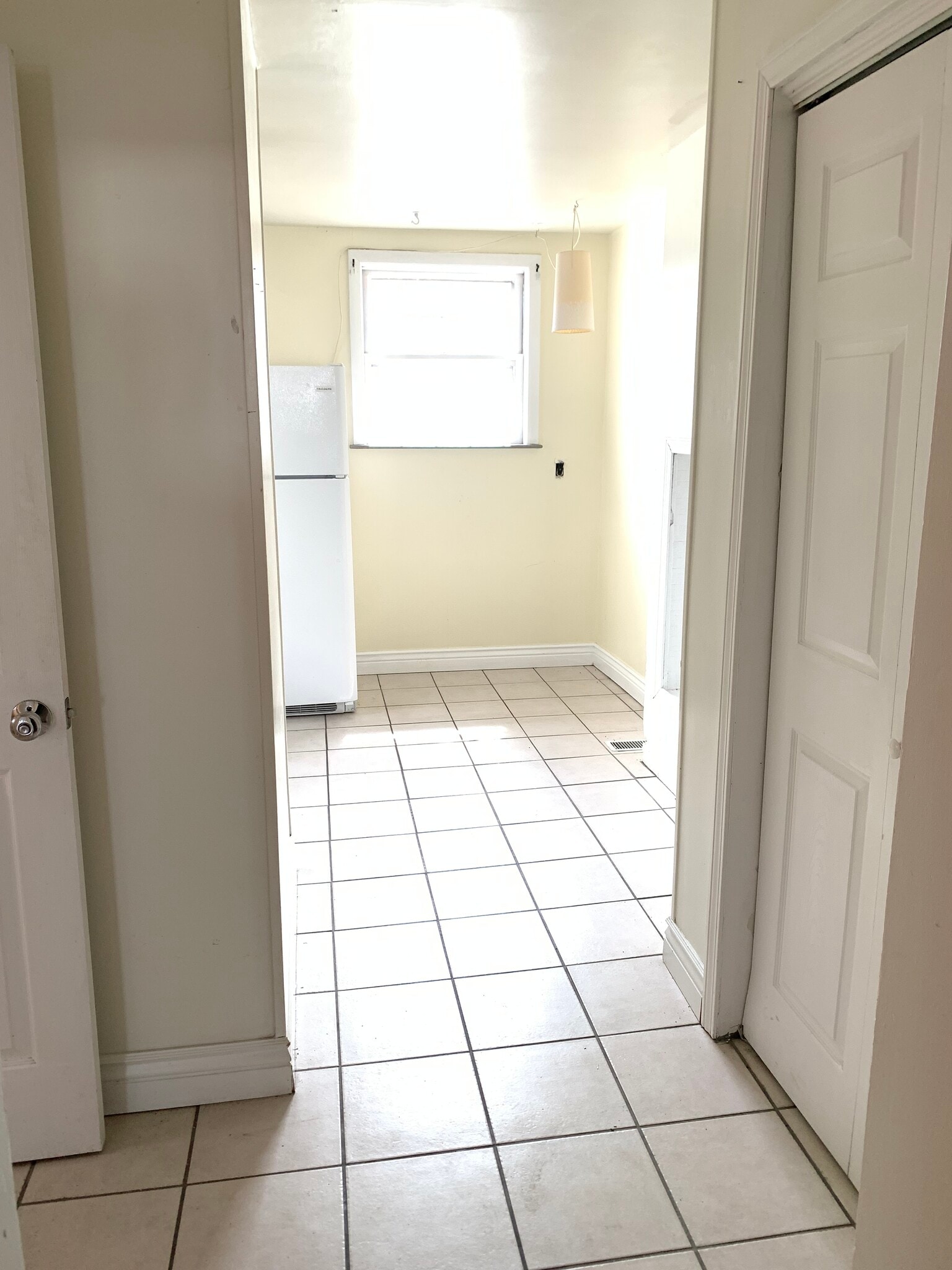 Entry hall and view into kitchen - 22 Lyon St