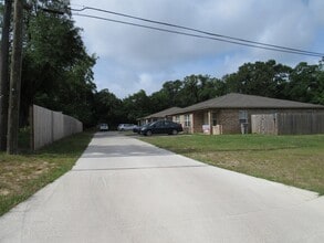 Building Photo - West Pensacola Duplex Living — 3BR Home with Open Floor Plan, Eat-In Kitchen, Covered Patio & Low...