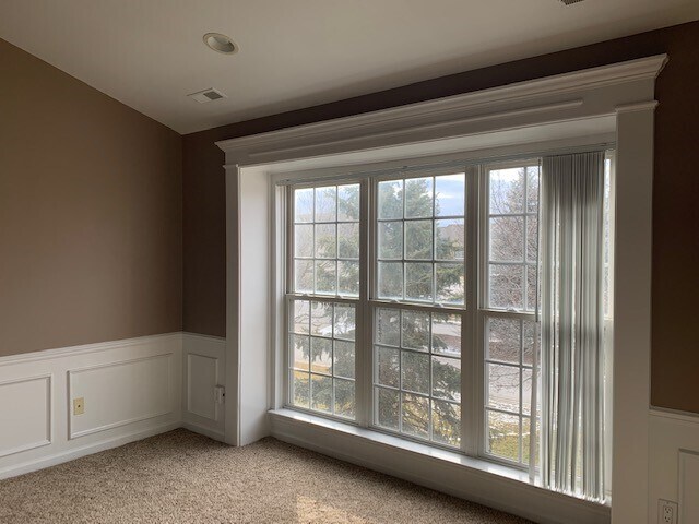 Huge living room window overlooking evergreens and flowering trees - 51870 Adler Park Dr E