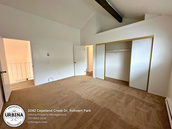 Building Photo - Charming 2-Bed, 1.5-Bath End-Unit Condo in...