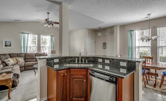 Building Photo - Relax and Unwind in this Spacious End-Unit...
