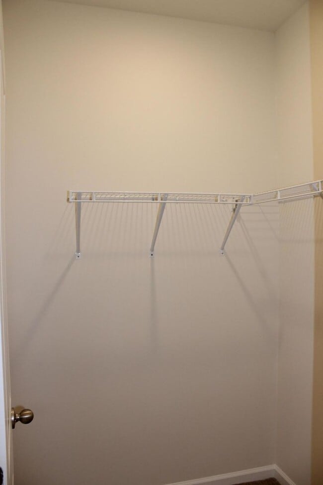 Building Photo - Sun-Filled 3-Story End-Unit Townhome with Fenced Yard, Storage & Resort-Style Pool