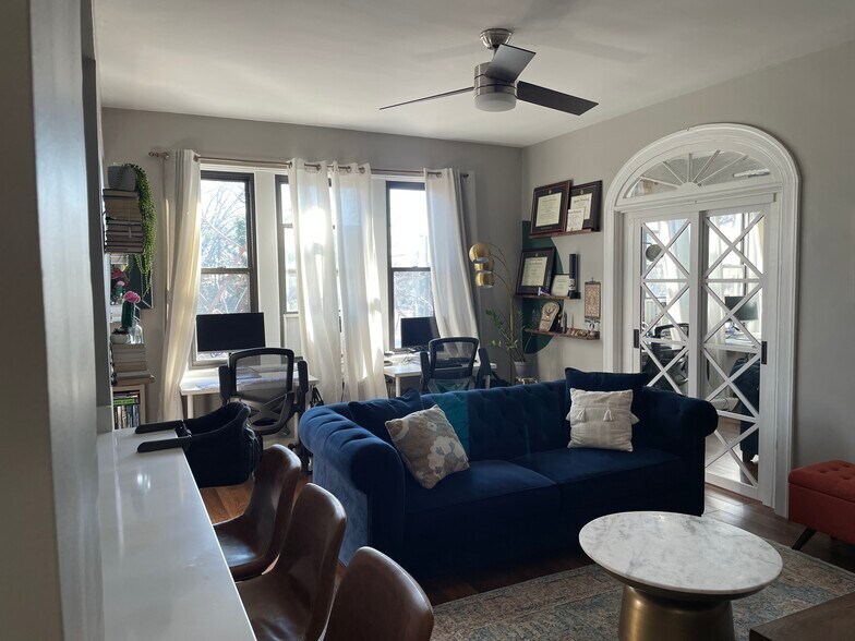 Living Room w/ sliding door to the 2nd bedroom - 4007 Connecticut Ave NW