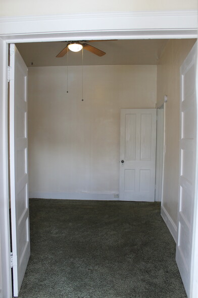 View from Foyer into first bedroom with doors open - 2928 Hooker St