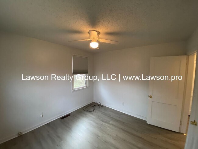 Building Photo - Well Maintained Three Bedroom with Fenced Yard and Shed