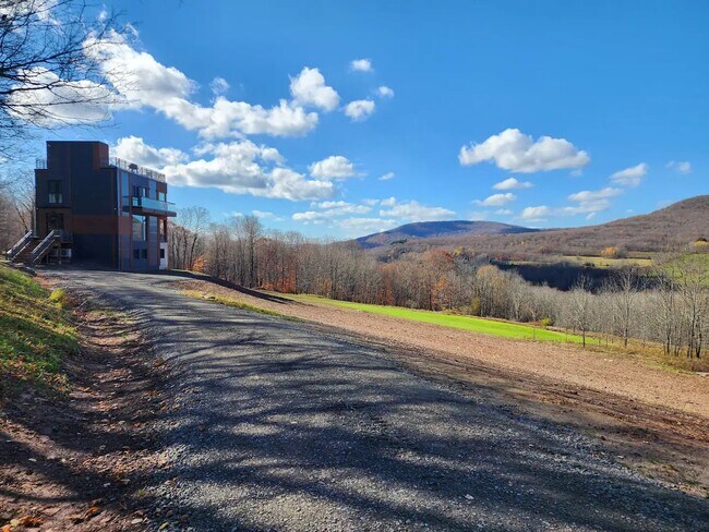 Building Photo - Modern Mountain Retreat with Rooftop Hot T...