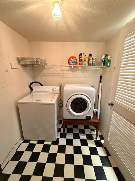 laundry room with dryer and washing machine - 810 Bellevue Rd
