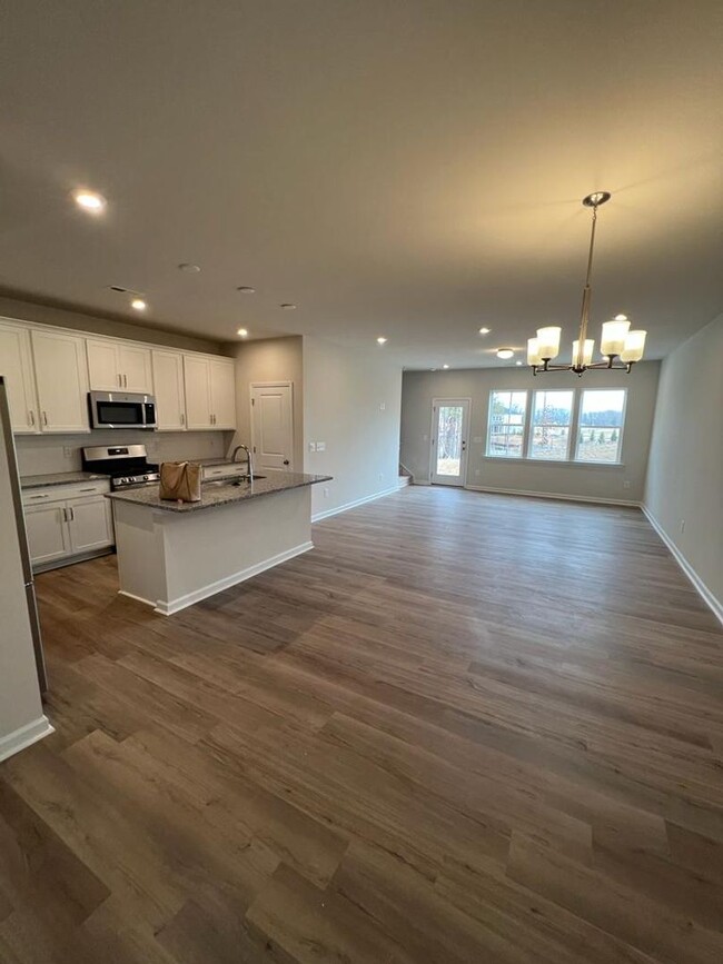 Building Photo - Townhome with 3BR/2.5BA Garage Located in ...