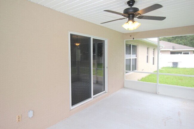 Building Photo - Huge 4 Bed 3 Bath Home w FENCED YARD and SCREENED LANAI for Rent!