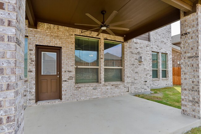 Great patio with ceiling fan for comfort year round. - 253 Gill Point Ln