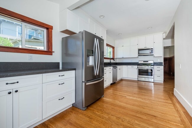 Newly renovated chef's kitchen with updated appliances. - 431 Athol Ave