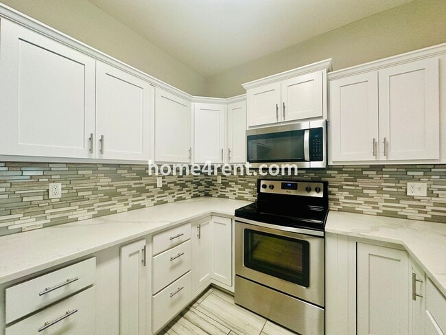 Building Photo - Ranch Style Home w/ Updated Kitchen, including SS Appliances and Granite Counters Plus a Large Un...