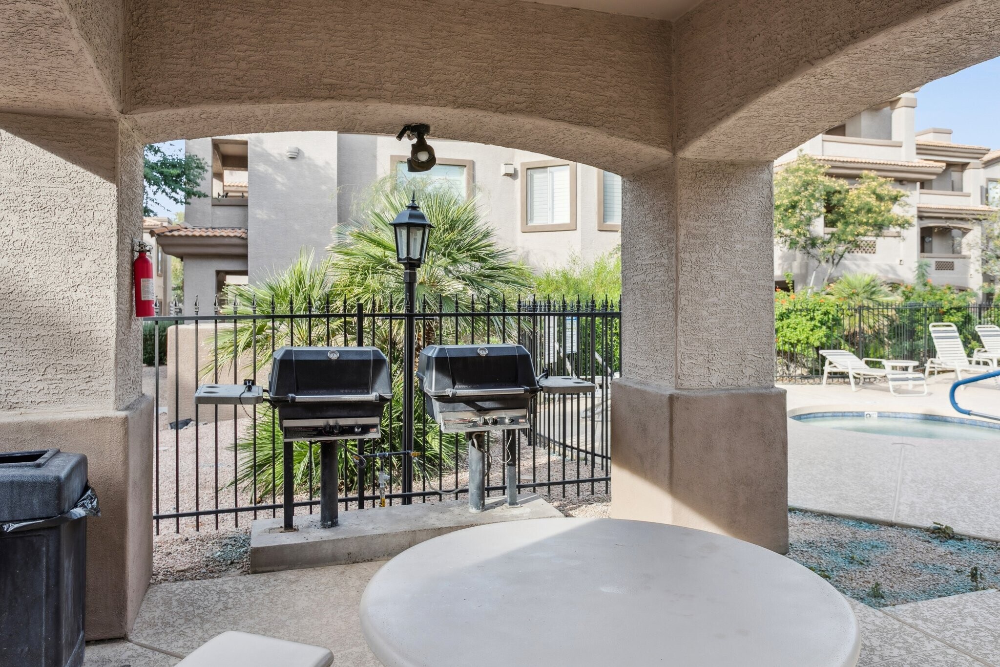 Covered barbecue area by the pool - 14000 N 94th St