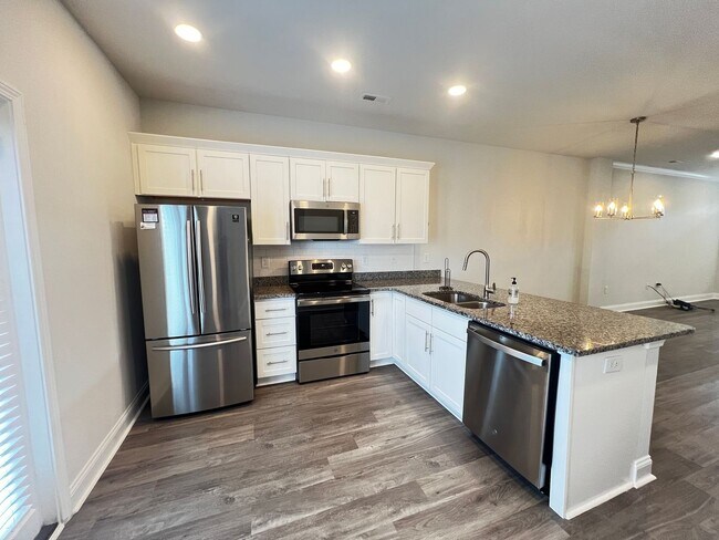 Building Photo - Available Now! - Pet Friendly 2 Bedroom, 2.5 Bath Townhome at Market Common! Cable and Internet I...