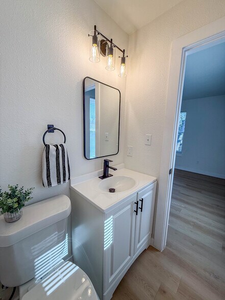 Half bath in primary bedroom - 308 E Bourn St