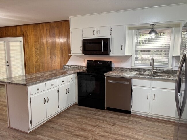 Building Photo - Nice brick home, single carport, storage b...