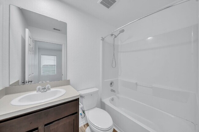 Building Photo - Like-new three bedroom single story home featuring a spacious open floor plan ideal for modern li...