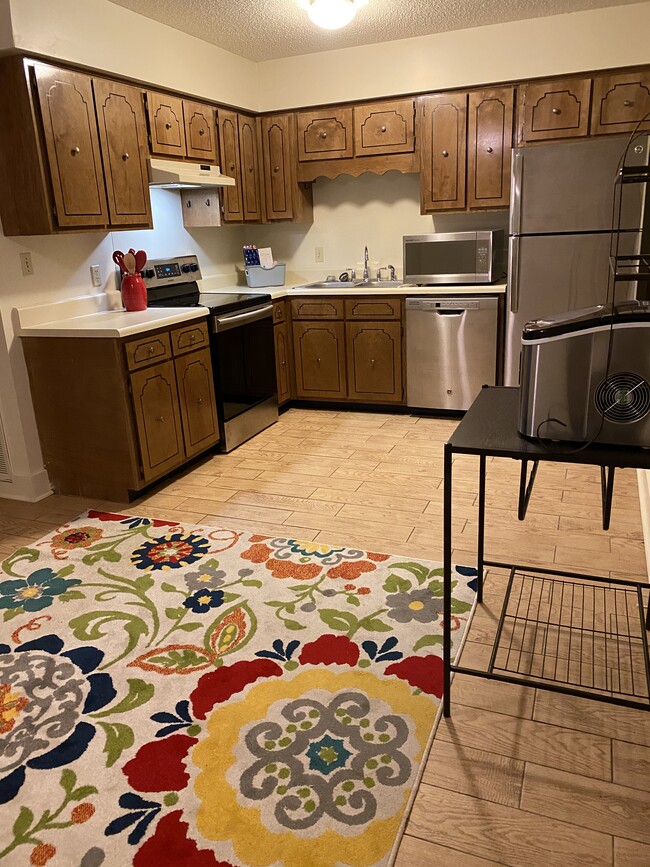 Fun rug goes in dining area of this unit - 114 Michael Dr