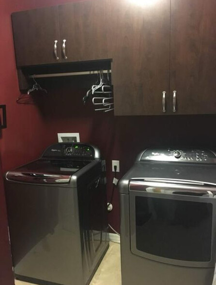 Laundry room with cabinets in the condo - 127 Explorer Dr