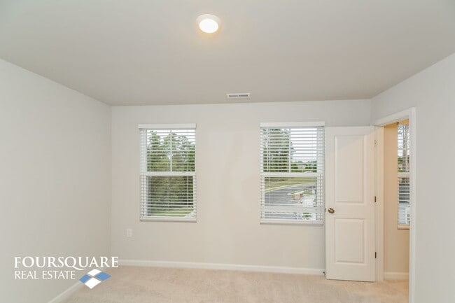 Building Photo - Modern 3-Story Townhome with First-Level B...