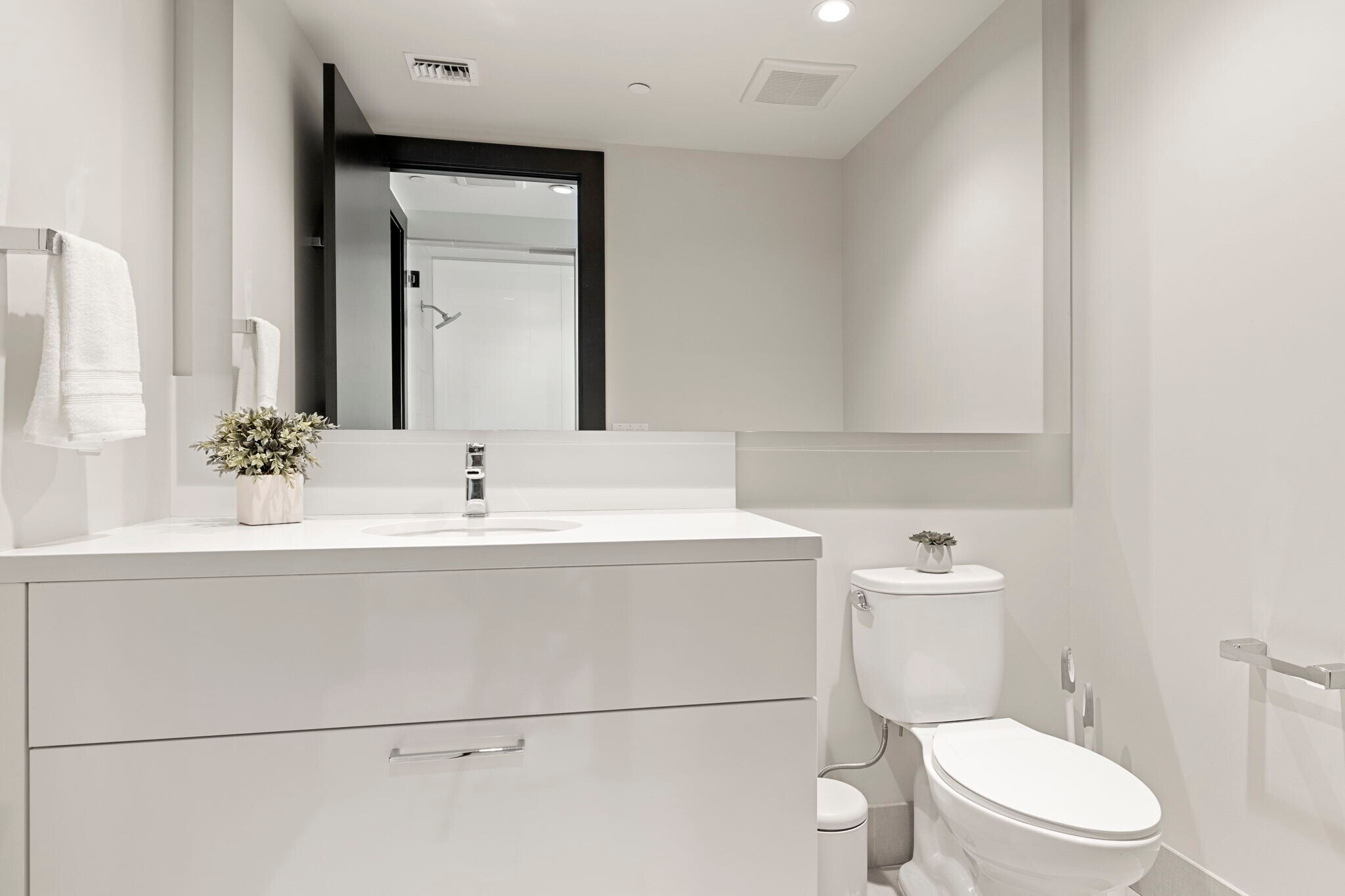 Floating vanity with quartz countertop, single sink and tile floors - 4422 N 75th St