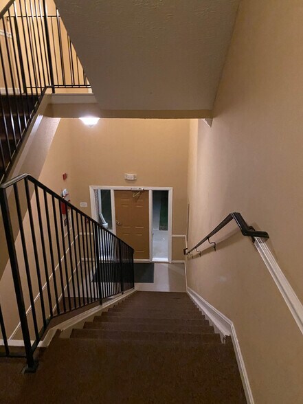 Stairs from main entrance into condo - 3712 Excalibur Ct