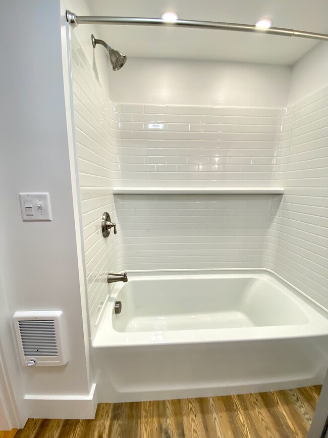 Tub/shower has fan/light with bluetooth speaker - 12 Exeter Rd