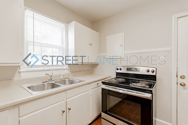 Building Photo - REDUCED! - NOW OFFERING HALF OFF FIRST FUL...