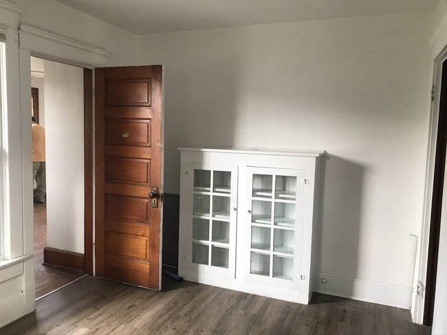 Family room with built-in and lots of natural light - 81 Hoover St