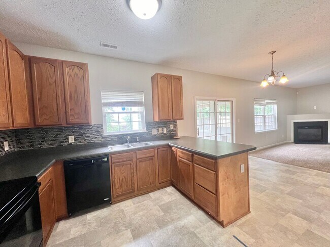 Building Photo - Charming 4BD, 2.5BA Durham Home with a Bonus Sun-Room & Fenced In Yard Only 10 Minutes Away from ...