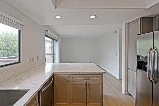 Building Photo - PRIME POOLFRONT LOCATION & CLOSE TO MAIN GATE! BRIGHT & SPACIOUS, END-UNIT POOLFRONT TOWNHOUSE W/...