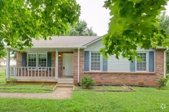 Building Photo - Charming Home With Spacious Living Room an...