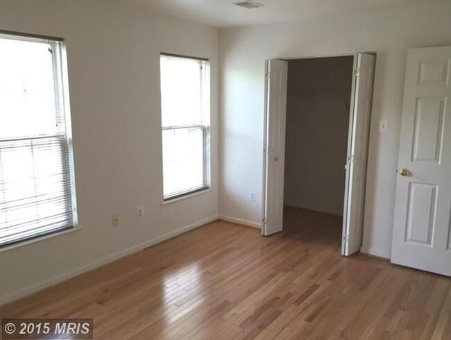 Building Photo - A spacious three bedroom, two and one half...