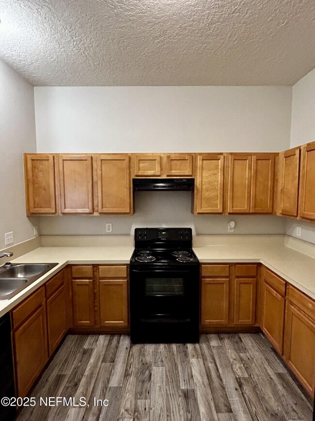 Building Photo - 6788 Manotak Oaks Dr