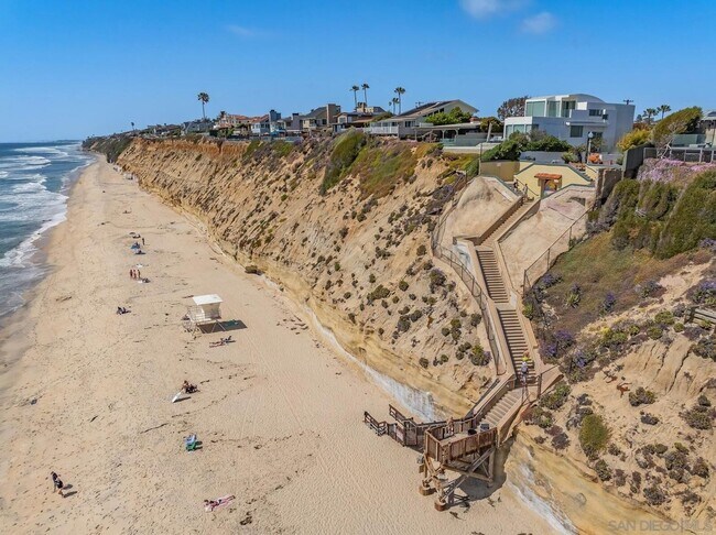 Building Photo - THE BEACH IS YOUR BACKYARD! Light & Bright...