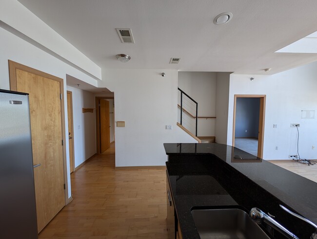 View of the kitchen looking out to the stairs - 2121 S Kinnickinnic Ave