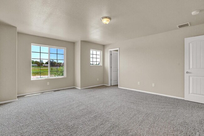 Building Photo - Modern Townhome with Central A/C, 2-Car Ga...