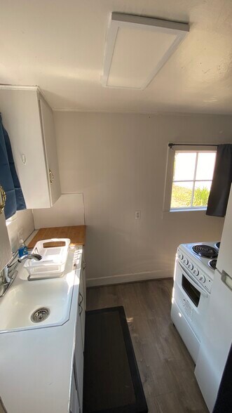 kitchen from bathroom - 132 NW 30th St