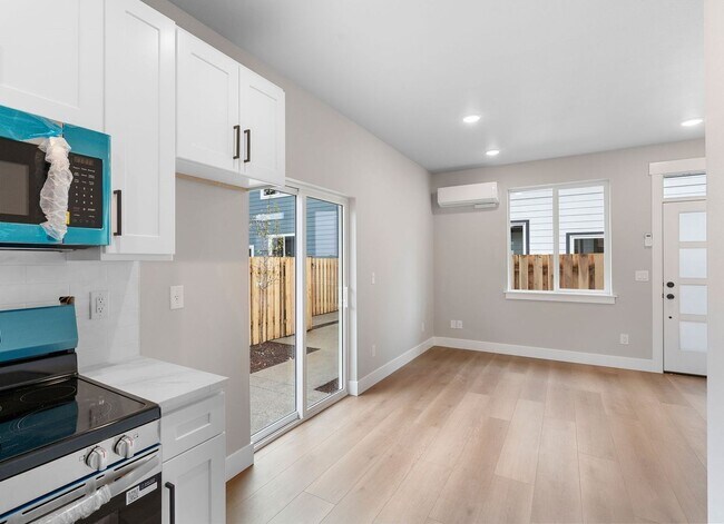 Building Photo - Brand-New Detached 2 Bedroom Home with Private Fenced Yard and Designer Finishes