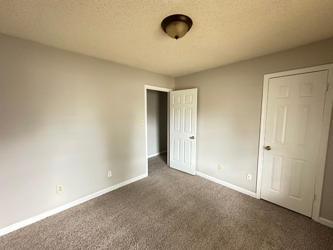 Building Photo - MOVE-IN READY! 3BR/2BA in Quiet Cove | Brick Fireplace | Fenced Yard & Patio!