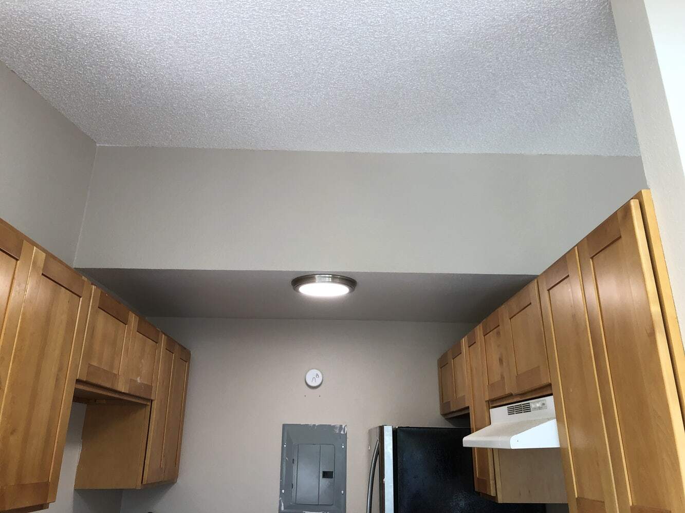 Kitchen has stainless steel appliances which open up to the dining and living room with a breakfast - 219 E 36th St