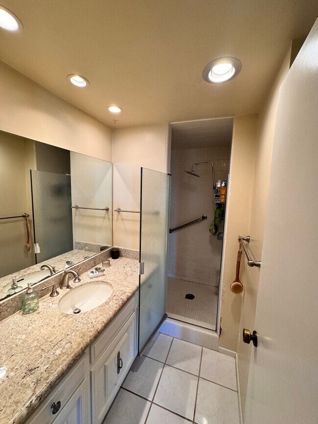 Shared bathroom with walk in shower. - 2910 S Peck Ave