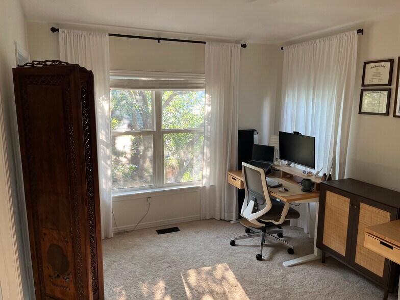 Second bedroom with custom walk-in closet and full bath. - 1641 N Washington St