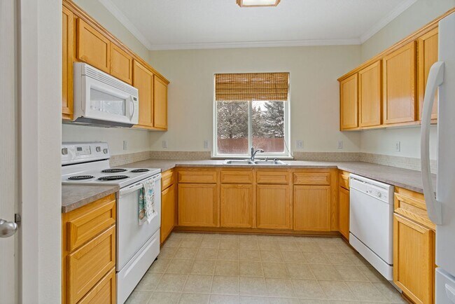 Building Photo - SPACIOUS LAYOUT! HARD SURFACE FLOORING, FENCED YARD & LARGE PATIO!