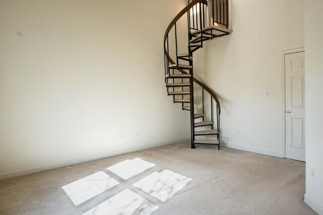 Building Photo - Beautiful brick townhome featuring three f...