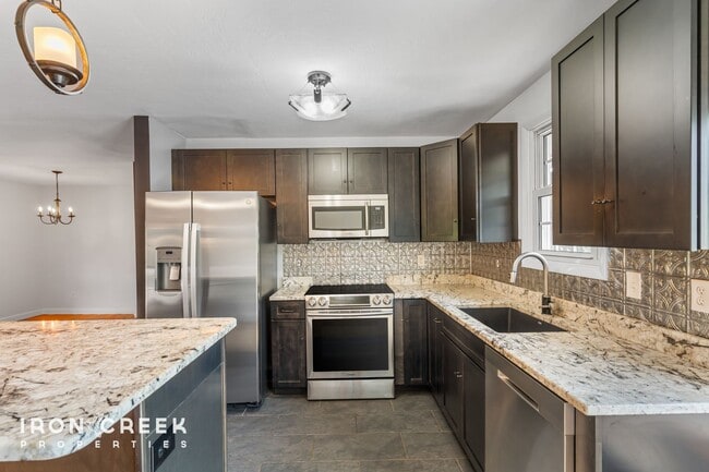 Building Photo - Beautifully Updated Three-Bedroom with Koi...