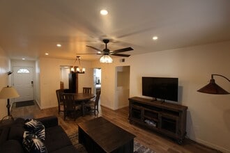 Building Photo - $300 Move-In Special | Ground-Floor Furnished Condo with Small Fenced Yard