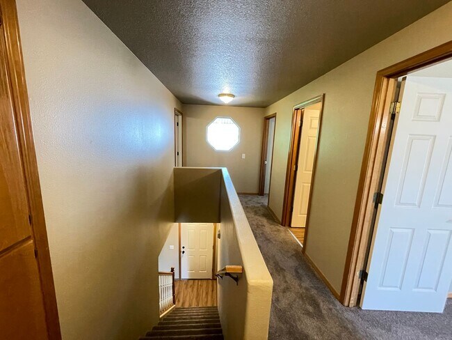 Building Photo - Spacious 4-Bedroom, 2.5-Bath Home with Deck, Fireplace & Updated Kitchen