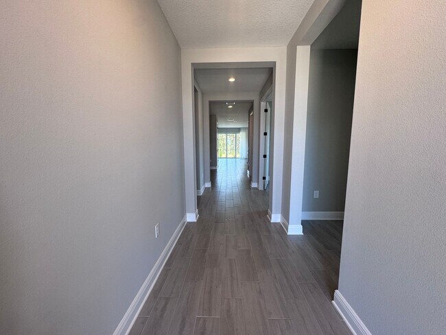 Building Photo - New Construction in Grand Park-4 Bedrooms and 4 Bathrooms with a Den and a Loft! No deposit for q...